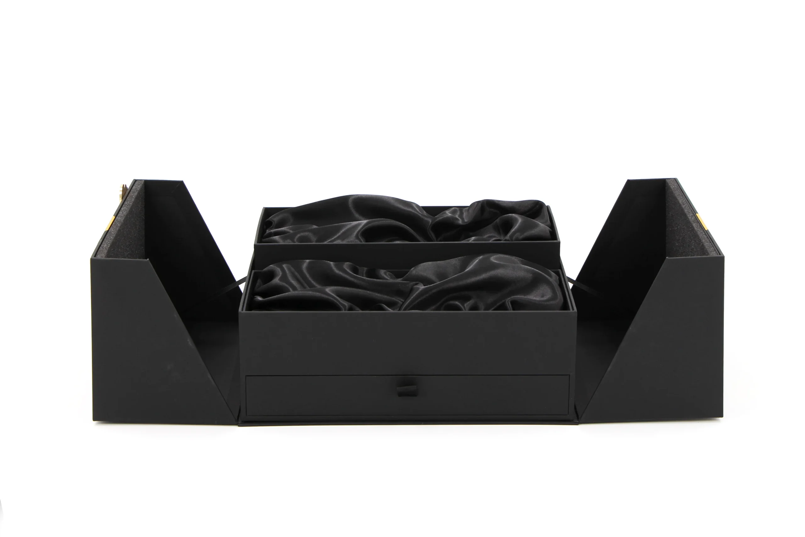 Open black Eid gift box presenting a coordinated luxury tableware set